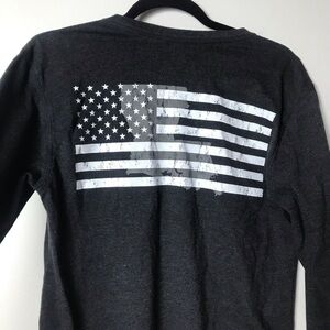 Men’s small. State of mine. Louisiana on sleeve and pic of USA flag on back.